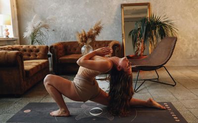 Atmospheric yoga studio with soft lighting